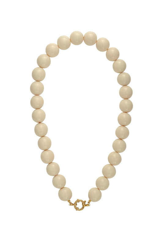 Collier de perles à attache centrale